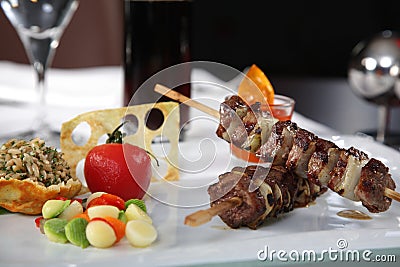 Meat Skewers with tomato and rice Stock Photo