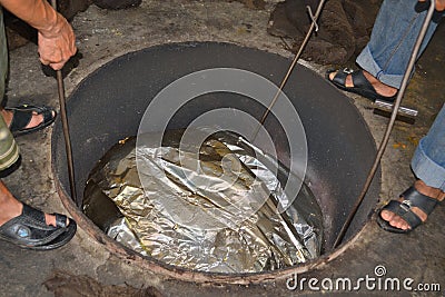 Meat smoker out of the hole Stock Photo