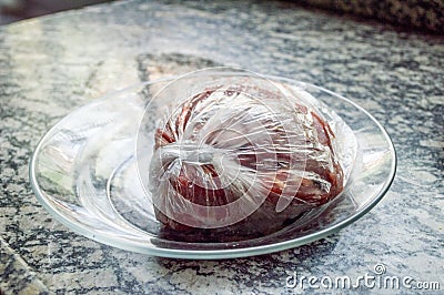 Meat thawing in marble sink for meal preparation Stock Photo