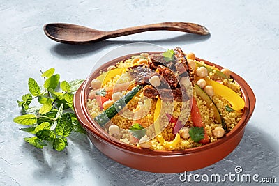 Meat and vegetable couscous, traditional Moroccan food, with fresh cilantro Stock Photo