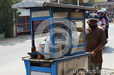 meatball seller cross in the road bekasi. Editorial Stock Photo