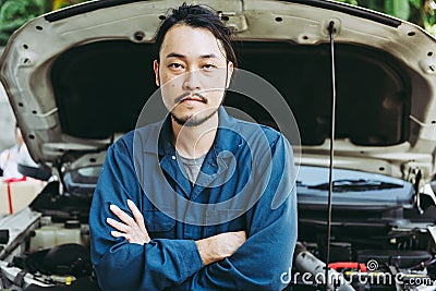 Mechanic Automobile Technician and Jobs Occupation Concept, Portrait Confident Man Technician Vehicle Automotive Standing Arm Stock Photo