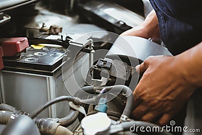 mechanic change air filter for car in automobile repair service. automotive spare part checkup in garage Stock Photo