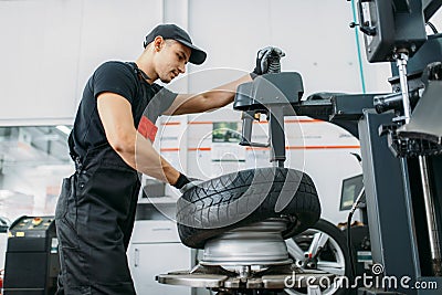 Mechanic change tire, repairing service Stock Photo