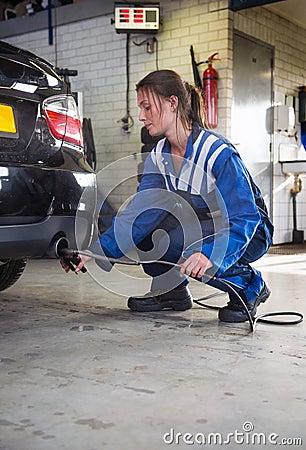Mechanic checking diesel exhaust emission rates Stock Photo