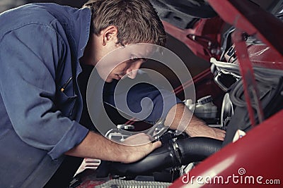 Mechanic fixing auto in car service Stock Photo