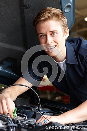 Mechanic fixing car Stock Photo