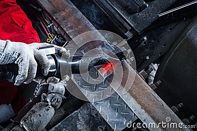 Mechanic heats the metal Stock Photo