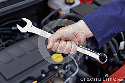 Mechanic Holding Spanner Fixing Car Engine Stock Photo