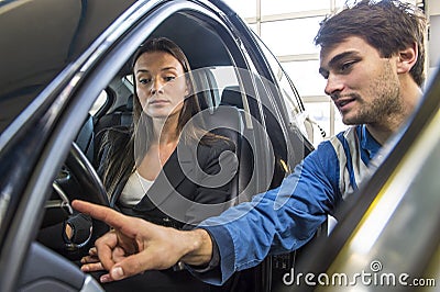 Mechanic instructing a customer Stock Photo