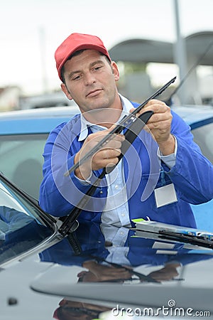 Mechanic ready to change windscreen wiper or mechanic Stock Photo