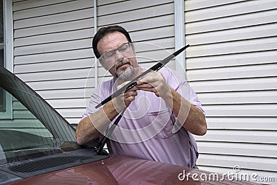 Mechanic Removing Worn Out Windshield Wipers Stock Photo