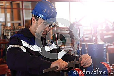 The mechanic - the repairman , operator production gas, Oil, gas industry. gas conditioning equipment and valve armature Stock Photo