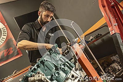 Mechanic Restoring Vintage Engine Editorial Stock Photo