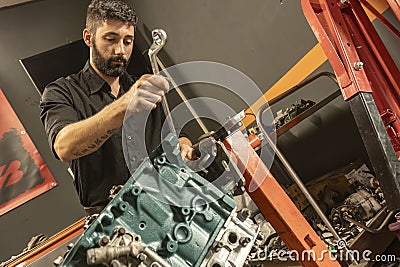 Mechanic Restoring Vintage Engine Editorial Stock Photo