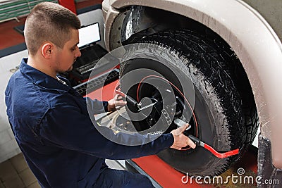 Mechanic tuning aligner for wheel alignment Stock Photo