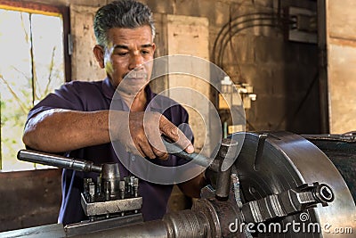 Mechanic turner working Stock Photo