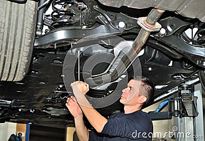 Mechanic under car. Stock Photo