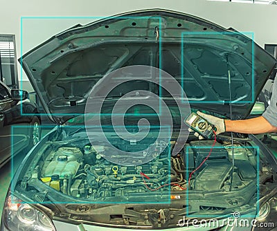 mechanic a voltmeter to check the voltage Man asian Car checking inspection to To take a photo for fix Re Stock Photo