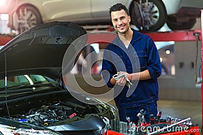 Car mechanic in auto repair shop Stock Photo