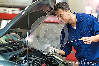 Car mechanic working on a car Stock Photo