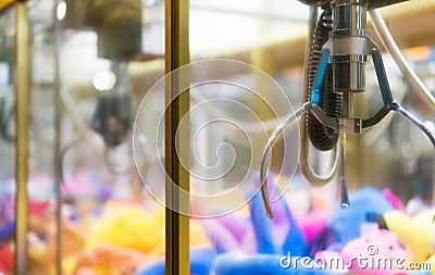 Mechanical claw game machine. Stock Photo