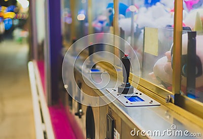 Mechanical claw game machine. Stock Photo