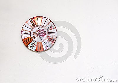 Mechanical watch with a dial on a white wall, Roman numerals, cl Stock Photo