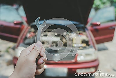 Mechanical engineer hands open the car skirt to check the oil level of the car. The concept of engine maintenance Travel safely Stock Photo