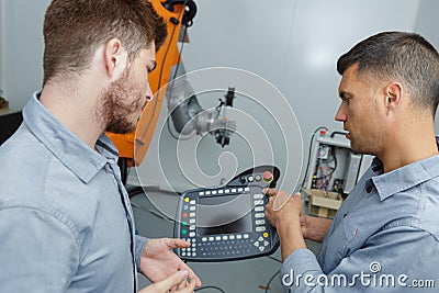 mechanical engineering apprentice in robotic class Stock Photo