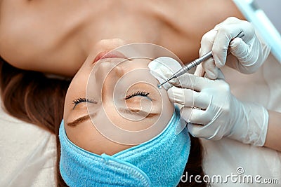 Mechanical face cleaning in the beauty salon Stock Photo