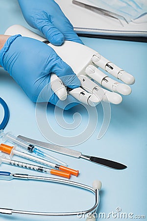 Mechanical prosthetic arm for disabled. Consultation with doctor Stock Photo