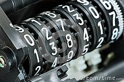 mechanical scoreboard with different white numbers on black counter rolls Stock Photo