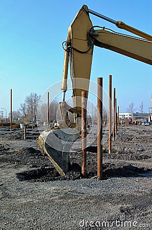 Mechanical shovel in close up unloading earth Stock Photo