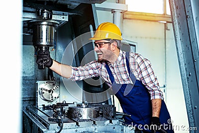 Mechanical technician worker of cnc milling cutting machine center at tool workshop manufacturing Stock Photo