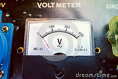 Mechanical voltmeter close up. Voltage measuring device on a gasoline generator Stock Photo