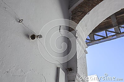 Mechanically operated doorbell on a torsion spring actuated by a wire Stock Photo