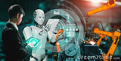 Mechanized industry robot and human worker working together in future factory Stock Photo