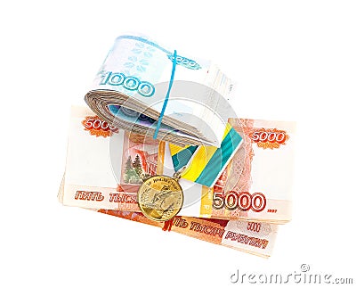 Medal `For great job` and stacks of russian banknotes Stock Photo