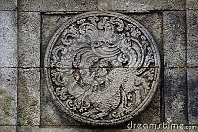 medallion in the penataran temple with animal reliefs Stock Photo