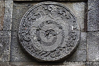 medallion in the penataran temple with animal reliefs Stock Photo