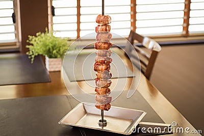 medallion, pork rolled in bacon served in churrascaria. Stock Photo