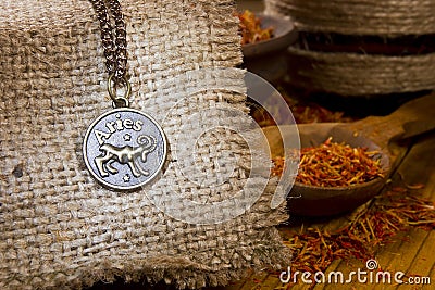 Medallion with the sign of Aries and saffron Stock Photo