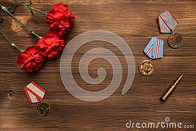 Medals and flowers on wooden table for day of glory, 9 may. Stock Photo