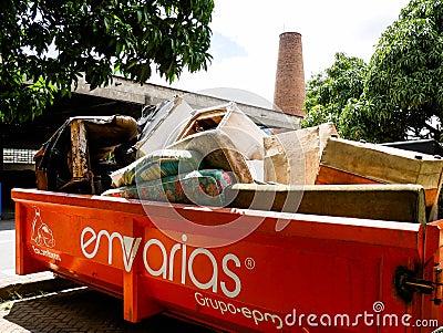 Medellin, Colombia, October 15 2019: a container of Emvarias full of discarded furniture ready to be disposed or recycled Medellin Editorial Stock Photo