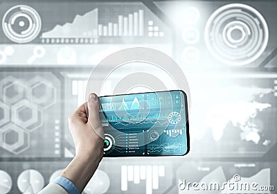 Media technology concept presented by businessman holding tablet with graphs and diagrams Stock Photo