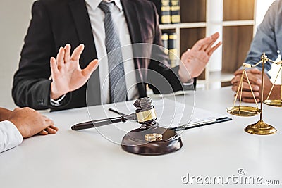 Mediation between marriage, husband and wife during divorce process with male lawyer counselor and signing of divorce contract Stock Photo