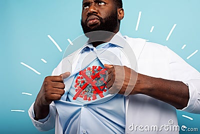 Medic acts like a superhero to fight pandemic of covid19 coronaviruses. Blue background Stock Photo