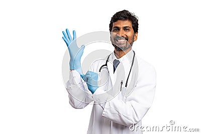 Medic putting on surgical glove Stock Photo