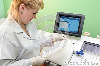 medic using test equipment Stock Photo